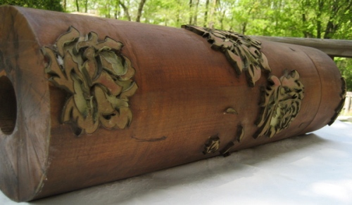 This is an antique wooden roller for printing wallpaper